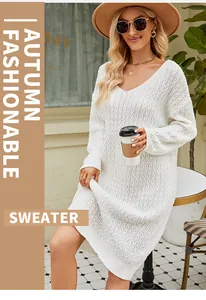 Detailed shot of white oversized cable knit sweater dress with stylish V-neckline