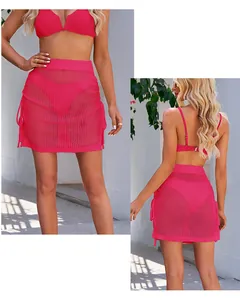 Detailed front and back view of a sexy pink crochet mesh mini skirt with side drawstrings