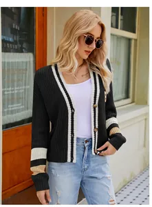 Detail view of women's black V-neck preppy style knit cardigan with striped sleeves and buttons