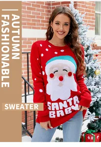 Detail shot of a red Christmas pullover featuring a Santa Claus and Santa Baby design.