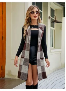Chic sleeveless long plaid knit cardigan vest paired with a black top and leather shorts