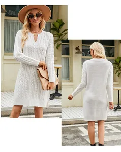 Close-up detail of white cable-knit mid-length sweater dress featuring soft knit texture