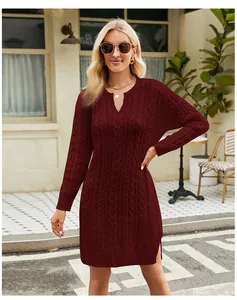 Full shot of burgundy cable-knit midi dress with side slits on model in an outdoor setting