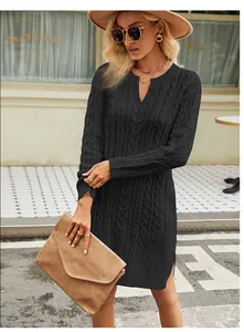 Elegant black cable-knit sweater dress with side slits and long sleeves for women.