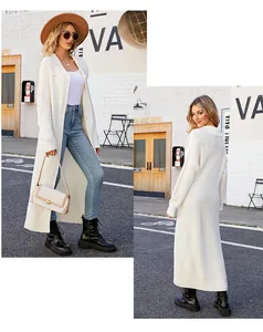 Detail showing the ribbed knit texture and long length of the white lapel cardigan