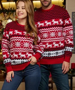 Couples in festive red Christmas sweaters with reindeer and snowflake knit patterns