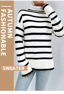 Macro view of the soft knit texture on this high-neck black and white striped winter top