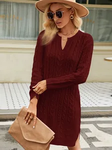 Elegant burgundy cable-knit sweater dress with side split shown on lifestyle model
