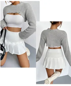Detailed macro view of a grey ultra-short knitted shrug sweater for women fashion style