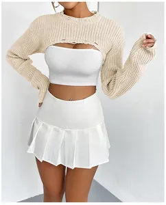 Close-up detail of a women's beige ultra-short knitted bolero shrug for sexy layering