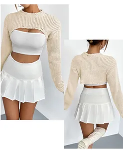 Detail of beige knitted super short shrug with long sleeves and distressed collar