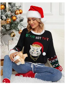 Detail view of festive black Christmas sweater with a cute sequined cat embroidery design