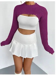 Trendy purple ultra-short knitted shrug bolero worn over a white tube top