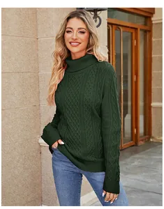 Detail shot of a dark green turtleneck cable-knit sweater with intricate knit patterns