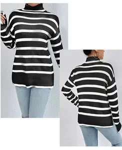 Detail view of women's black and white striped turtleneck knit sweater showing fit