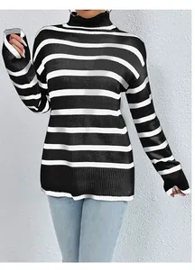 Close-up of black and white striped knit turtleneck sweater with ribbed cuffs and hem.