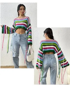 Detail view of rainbow striped cropped knit sweater with fringe showing front and back.