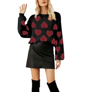 Sweet black knit sweater featuring red heart jacquard and bubble sleeves