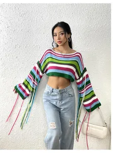 Model wearing a colorful rainbow striped cropped sweater with long tassel sleeves