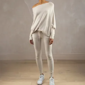 Full view of elegant off-shoulder beige knitted loungewear set with batwing sleeves