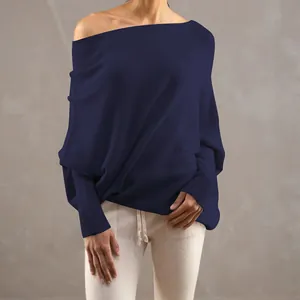 Detailed view of a navy blue off-shoulder knit sweater featuring stylish batwing sleeves