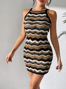 Detailed close-up view of a striped hollow knit bodycon mini dress in warm earthy tones