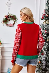 Detailed back view of a festive red Christmas sweater with white snowflake patterns on sleeves