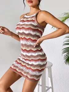 Detail of a summer sexy hollow-out knit striped camisole dress worn by a model.