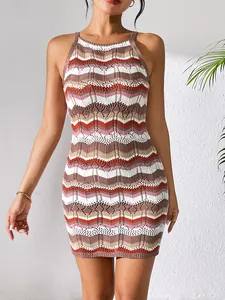 Detailed macro view showing texture of multicolored chevron stripe hollow-out knit dress.