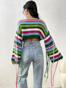 Back view of a sexy rainbow striped cropped knit sweater with colorful tassels