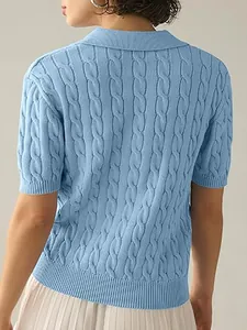 Detailed back view of a light blue short-sleeved cable knit polo sweater with fine texture