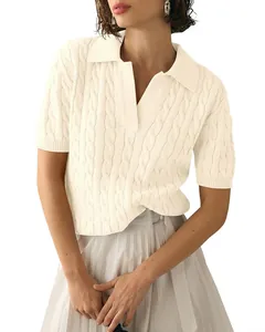 Detailed view of elegant women's cream cable-knit polo sweater featuring short sleeves