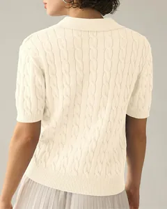 Detailed back view of cream short-sleeve cable-knit polo sweater showing texture