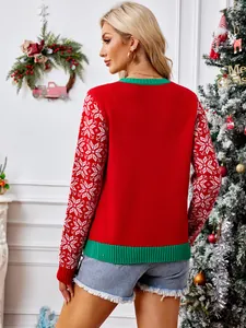 Red Christmas knit sweater with snowflake patterned sleeves and green ribbed trim