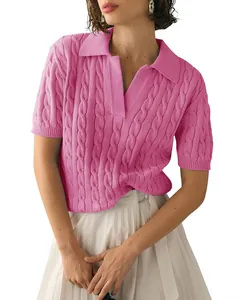 Close-up of a women's pink cable-knit polo sweater with short sleeves and V-neckline details