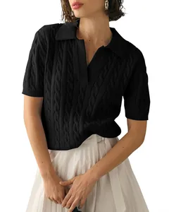 Detailed view of women's elegant black cable-knit polo sweater with short sleeves.