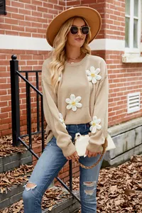 Stylish women's loose knit sweater with unique 3D crochet flower details on the sleeves.