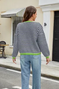 Back view of casual navy and white striped knit sweater with green trim details