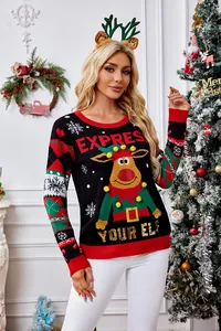 Détail du pull de Noël avec pompons 3D et broderie de renne en paillettes scintillantes