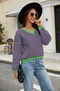 Casual striped color block V-neck sweater styled in an outdoor urban street setting