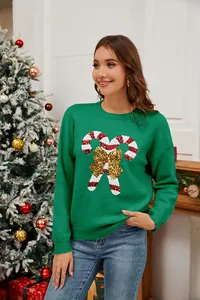 Maglione natalizio verde con decorazione in paillettes a forma di bastoncino