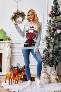 Woman wearing grey Christmas sweater with cute reindeer motif in holiday setting