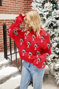 Detail of festive red Christmas sweater with Santa hat wine glass jacquard pattern