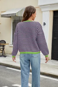Back view of a casual striped knit sweater with contrast neon green cuffs and hem
