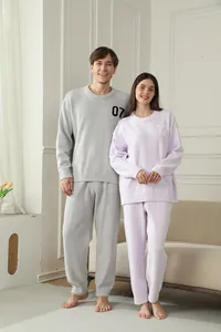 Matching plush couple loungewear set in soft grey and purple half-velvet material