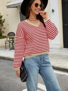 Stylish red and white striped V-neck sweater for women in an outdoor casual setting.