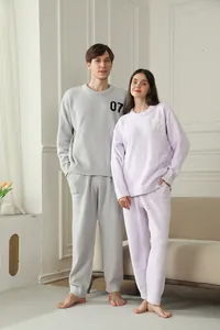 Comfortable winter plush couple pajama set in soft gray and purple fuzzy fleece fabric