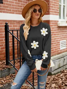 Women's loose black knit sweater with 3D white crochet flower appliques