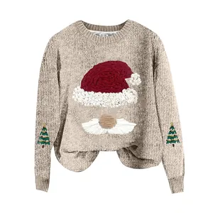 Detailed view of a beige knitted Christmas sweater with Santa hat and tree embroidery.