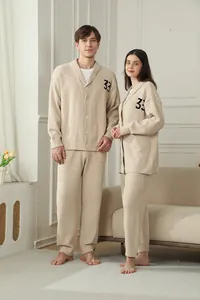 Cozy beige knitted loungewear set for couples featuring a V-neck cardigan with 33 detail